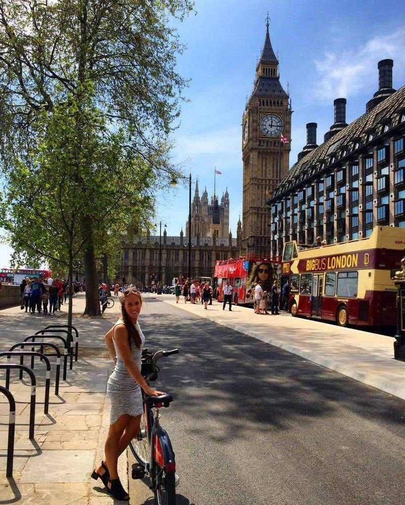 Cyclist by Big Ben and the Houses of Parliament in London